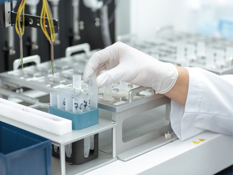 Scientist performing research in biopharma lab