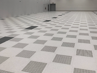The floor of a semiconductor fab facility that will require semiconductor tool installation