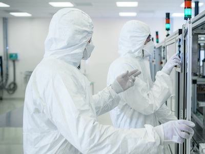 Life science experts working in a cleanroom environment