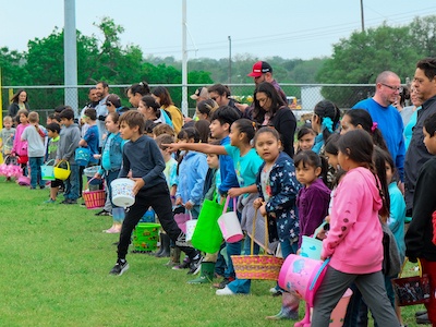 Children line up at the 4:12 Kids “Easter Eggstravaganza” to hunt for Easter Eggs