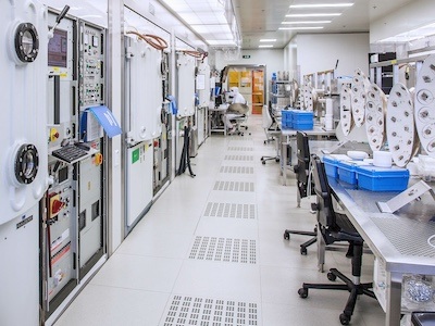 Research being performed in a cleanroom lab