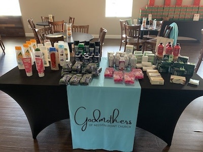 Table with items the Godmothers of Mission Point Church give out to the local community