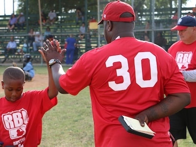 RBI Austin player and coach high-fiving