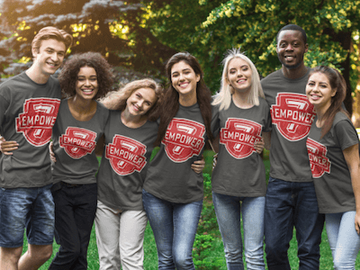 7 teenagers posing together in Empower 7 t-shirts