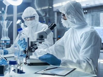 Biotech professionals performing research in a pharmaceutical lab