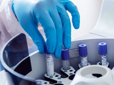 Pharmaceutical worker holding medicine manufactured in a Life Science lab