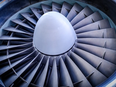 Jet engine turbine with blades and a metal casing in an aircraft maintenance facility