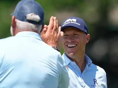 AM sponsored PGA golfer Ben Crane high-fives partner Darren Clarke during their victory at the American Family Insurance Championship at TPC Wisconsin